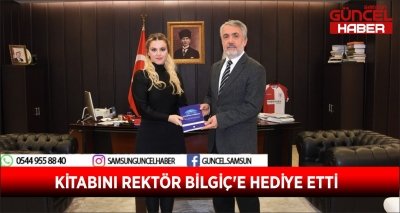 KİTABINI REKTÖR BİLGİÇ'E HEDİYE ETTİ