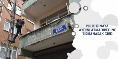 Polis binaya aydınlatma direğine tırmanarak girdi